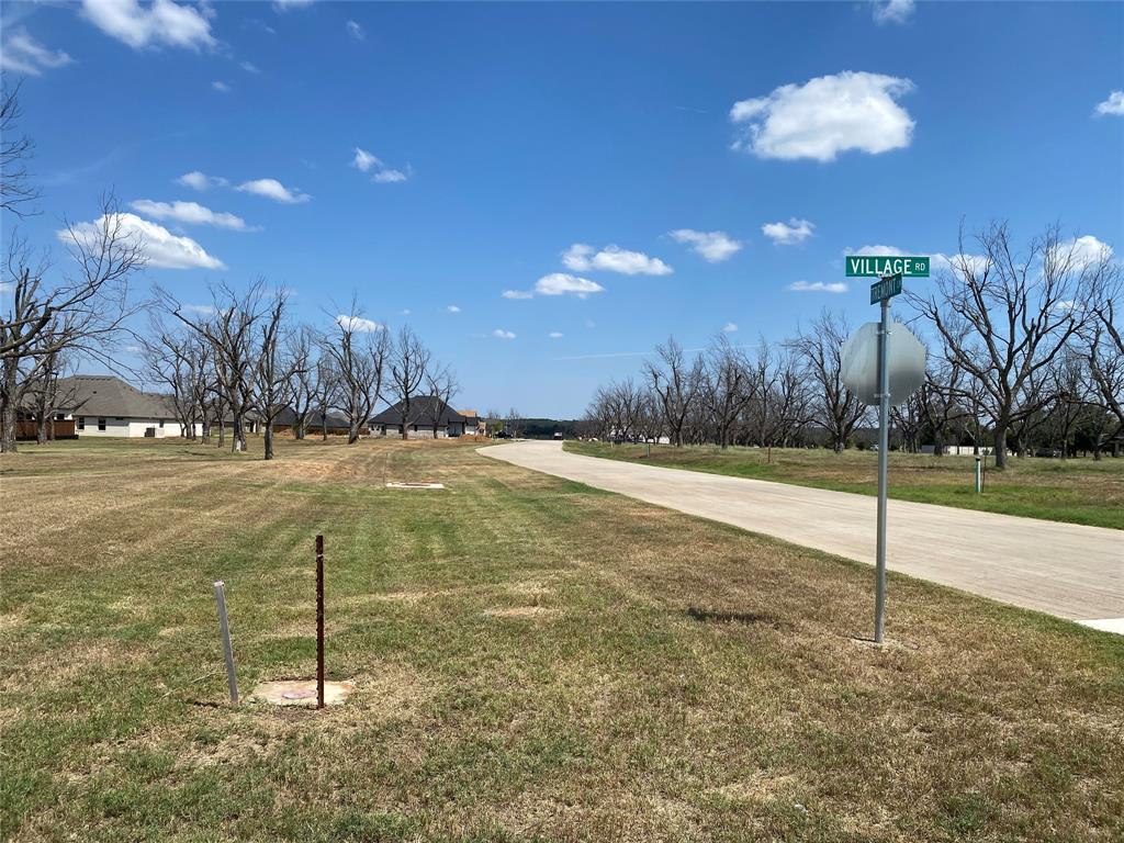 2722 Village Road Granbury, TX 76049 - Photo 2 of 3 a view of a yard