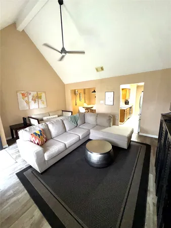 a living room with furniture and a table