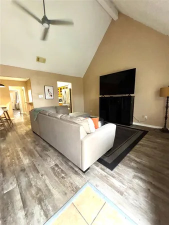 a living room with a couch and a flat screen tv