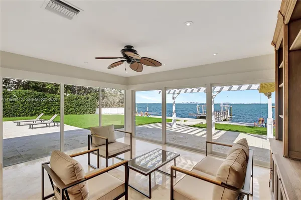 a view of a swimming pool with a table and chairs