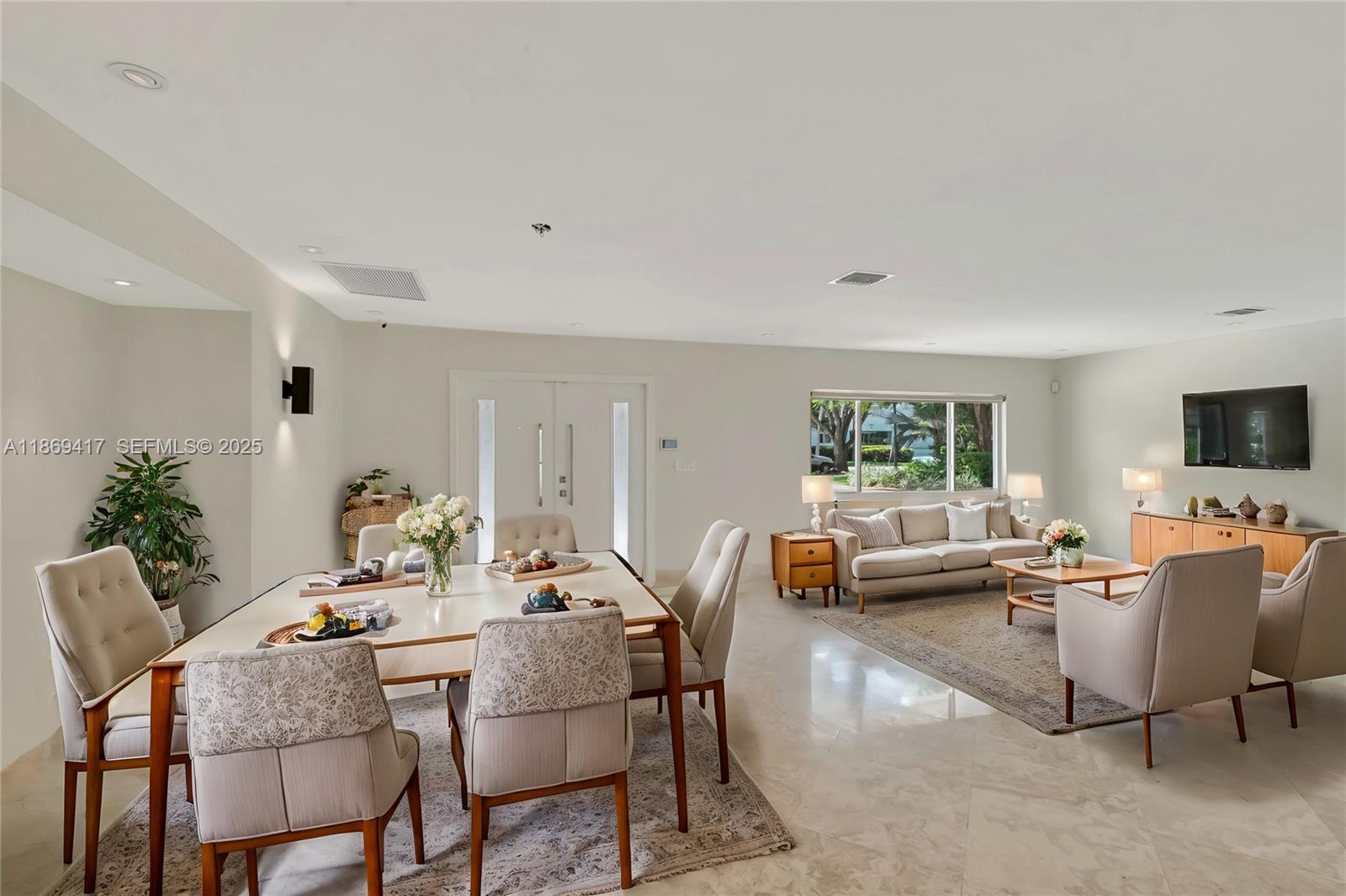 200 Harbor Drive Key Biscayne, FL 33149 - Photo 22 of 24 a living room with furniture and a flat screen tv