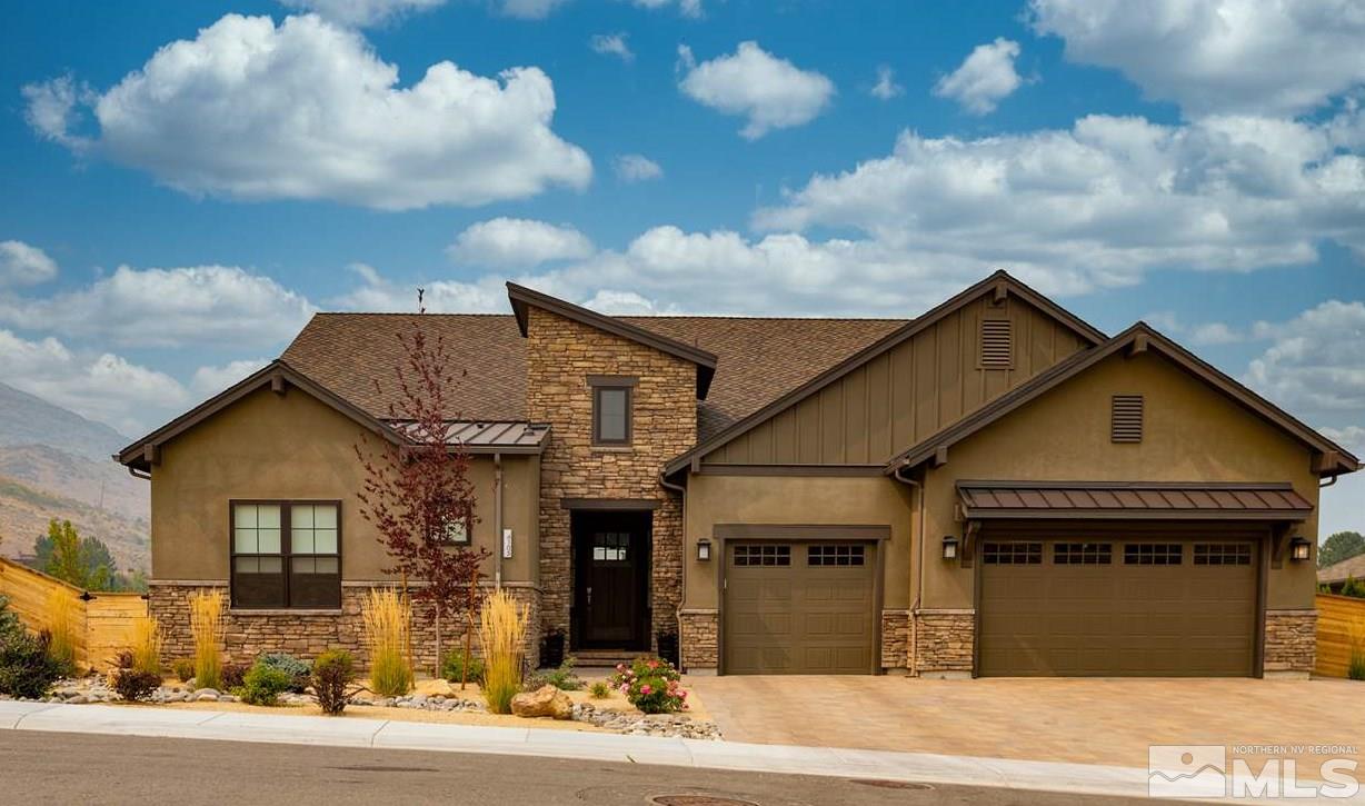 4105 Whispering Pine Loop Reno, NV 89519 - Photo 1 of 35 a front view of a house with a garden