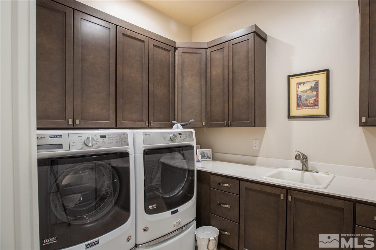 4105 Whispering Pine Loop Reno, NV 89519 - Photo 16 of 35 a utility room with dryer and washer