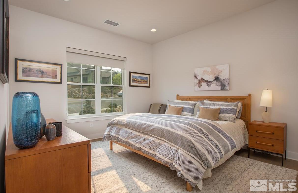 4105 Whispering Pine Loop Reno, NV 89519 - Photo 21 of 35 a bedroom with a bed and a window
