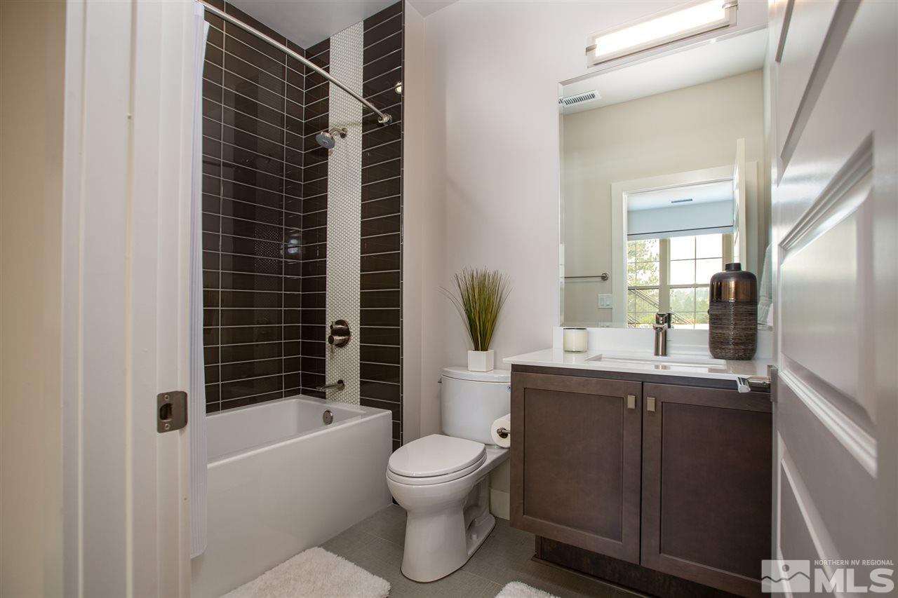 4105 Whispering Pine Loop Reno, NV 89519 - Photo 27 of 35 a bathroom with a sink toilet and shower