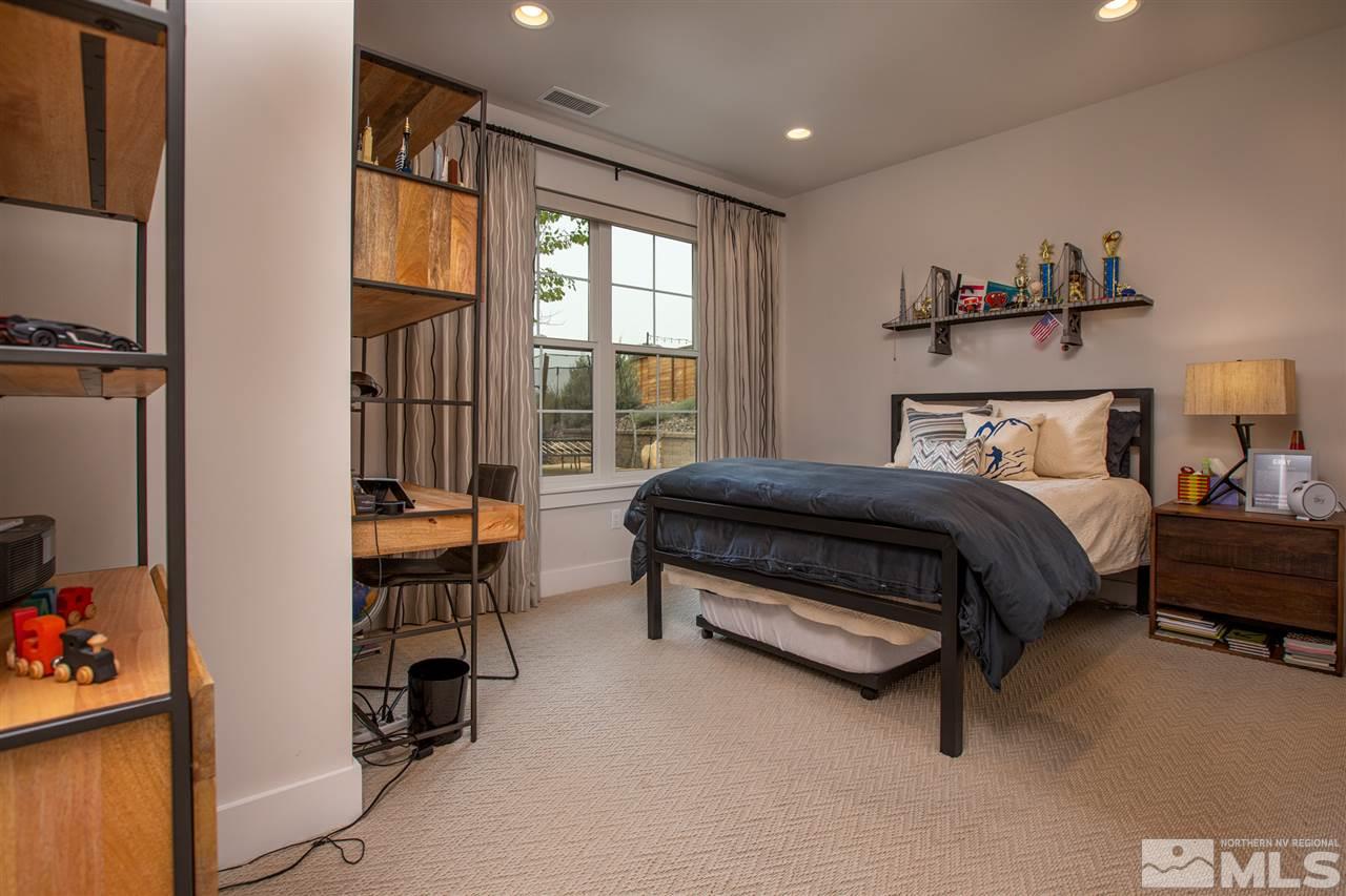 4105 Whispering Pine Loop Reno, NV 89519 - Photo 29 of 35 a bedroom with a bed and a window