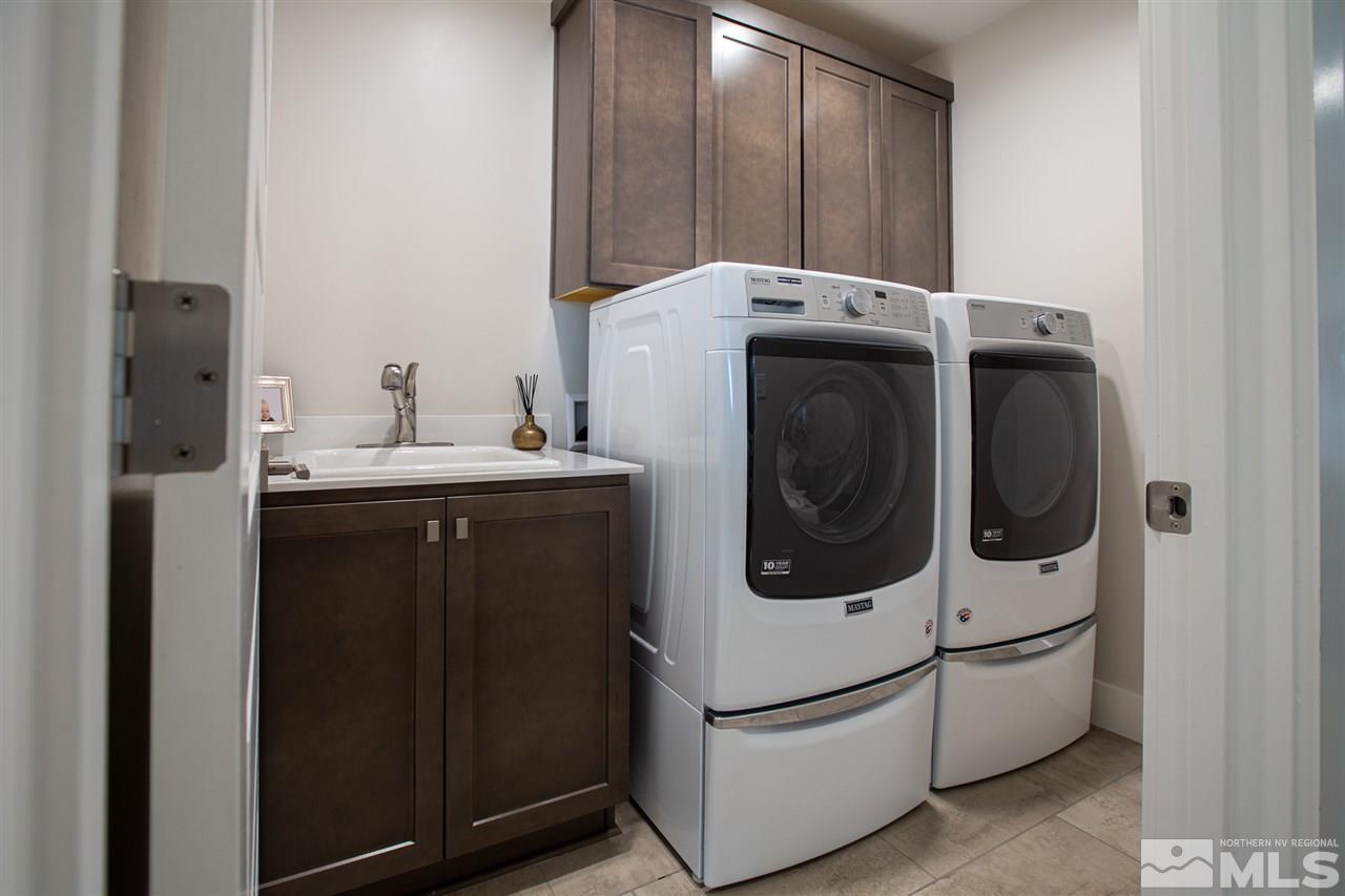 4105 Whispering Pine Loop Reno, NV 89519 - Photo 31 of 35 a utility room with dryer and washer
