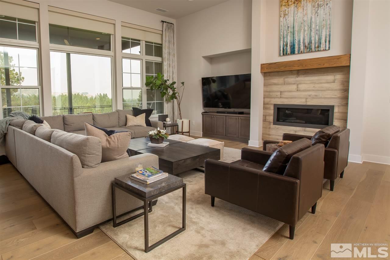 4105 Whispering Pine Loop Reno, NV 89519 - Photo 5 of 35 a living room with furniture tv and a fireplace
