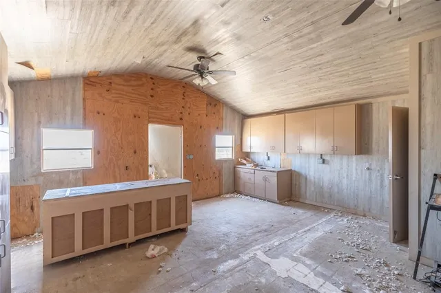 a kitchen with a wooden cabinets and counter space