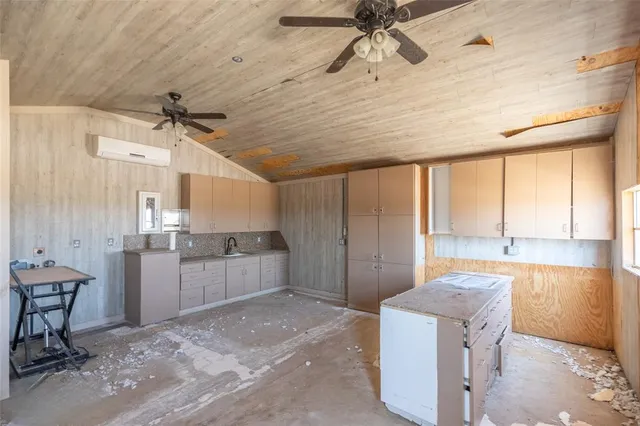 a bathroom with a toilet and a large window