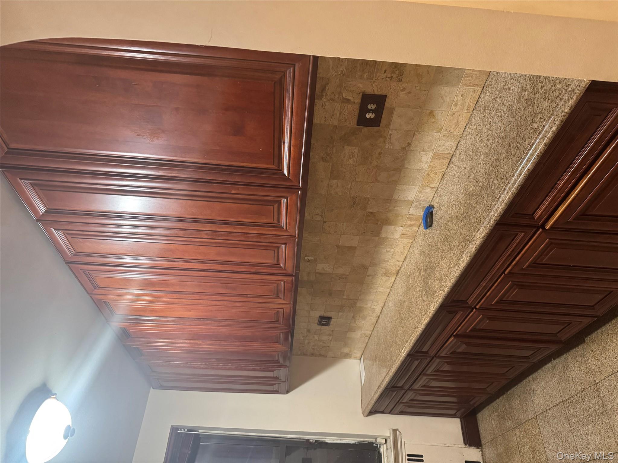 80-09 35th Avenue, Unit A12 Queens, NY 11372 - Photo 14 of 22 a kitchen with a sink and cabinets