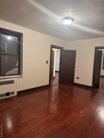 a view of a livingroom with wooden floor