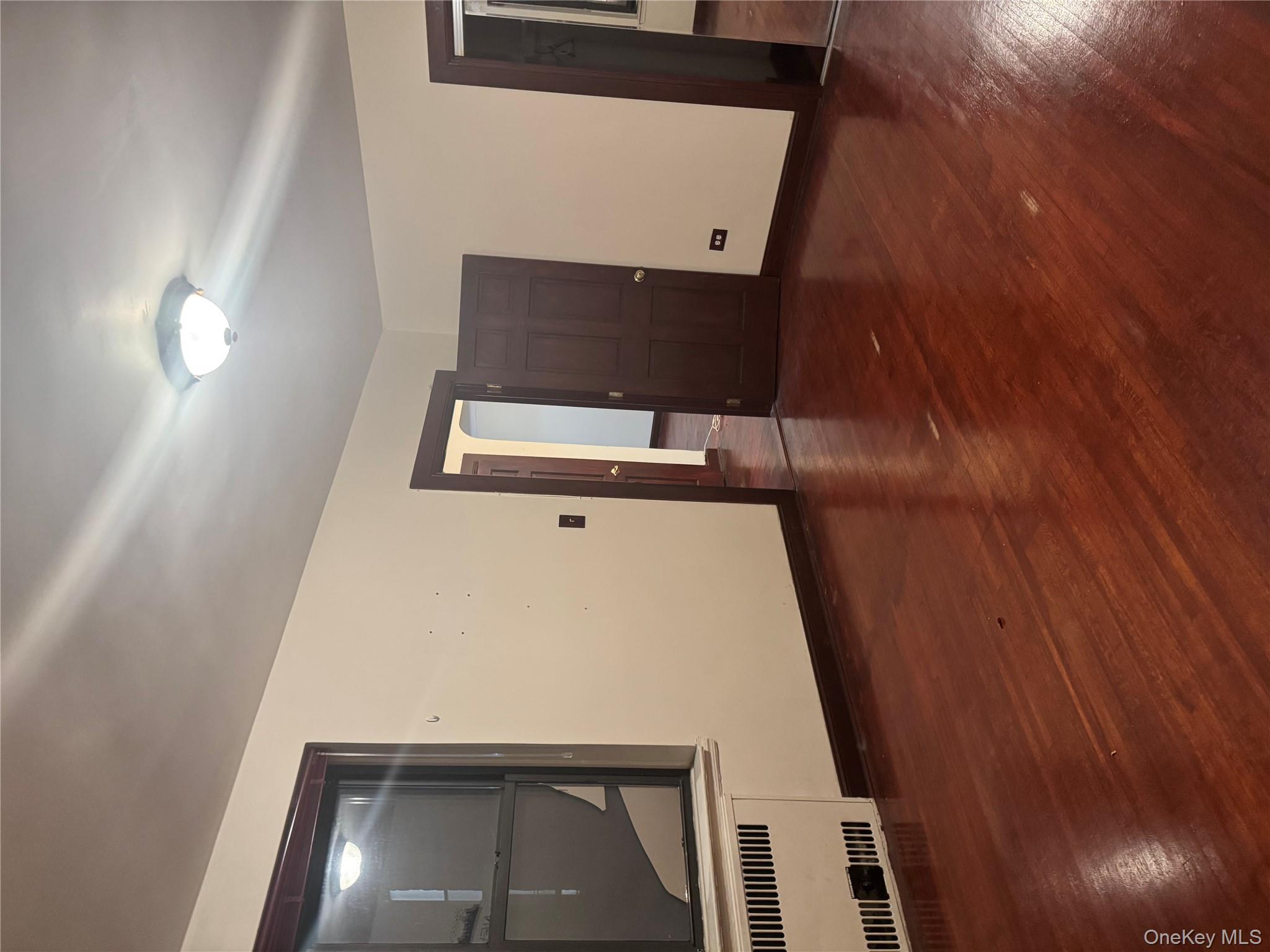 80-09 35th Avenue, Unit A12 Queens, NY 11372 - Photo 17 of 22 a view of a livingroom with wooden floor