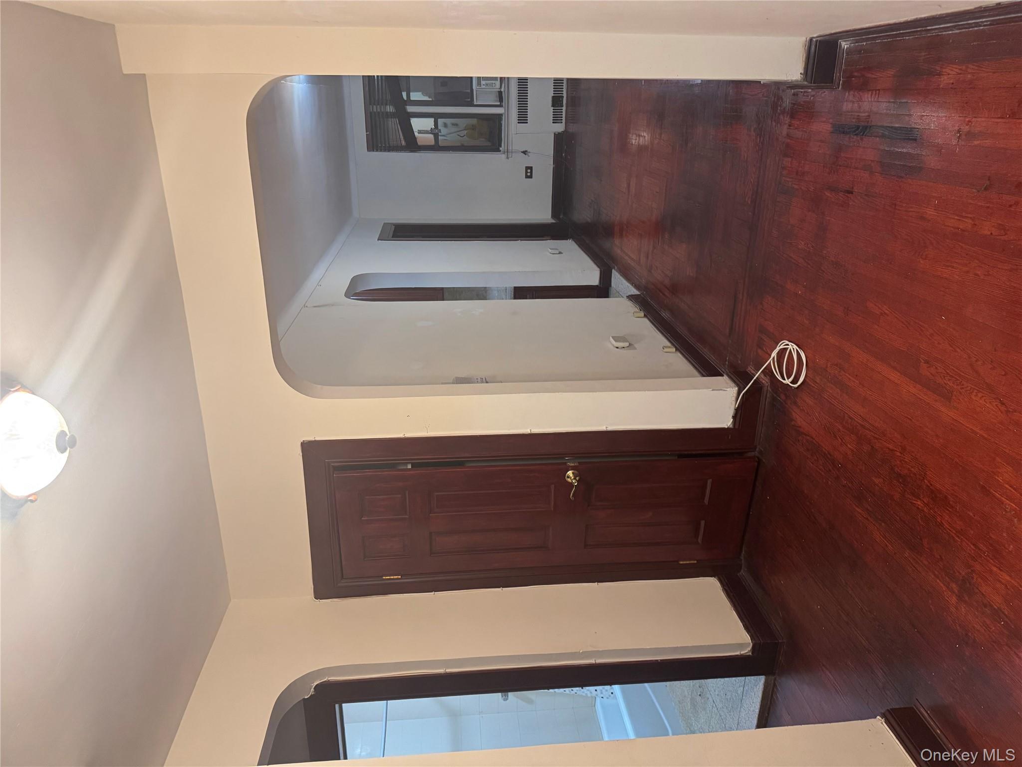 80-09 35th Avenue, Unit A12 Queens, NY 11372 - Photo 20 of 22 a view of a hallway with wooden floor