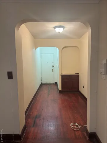 a view of a livingroom with wooden floor