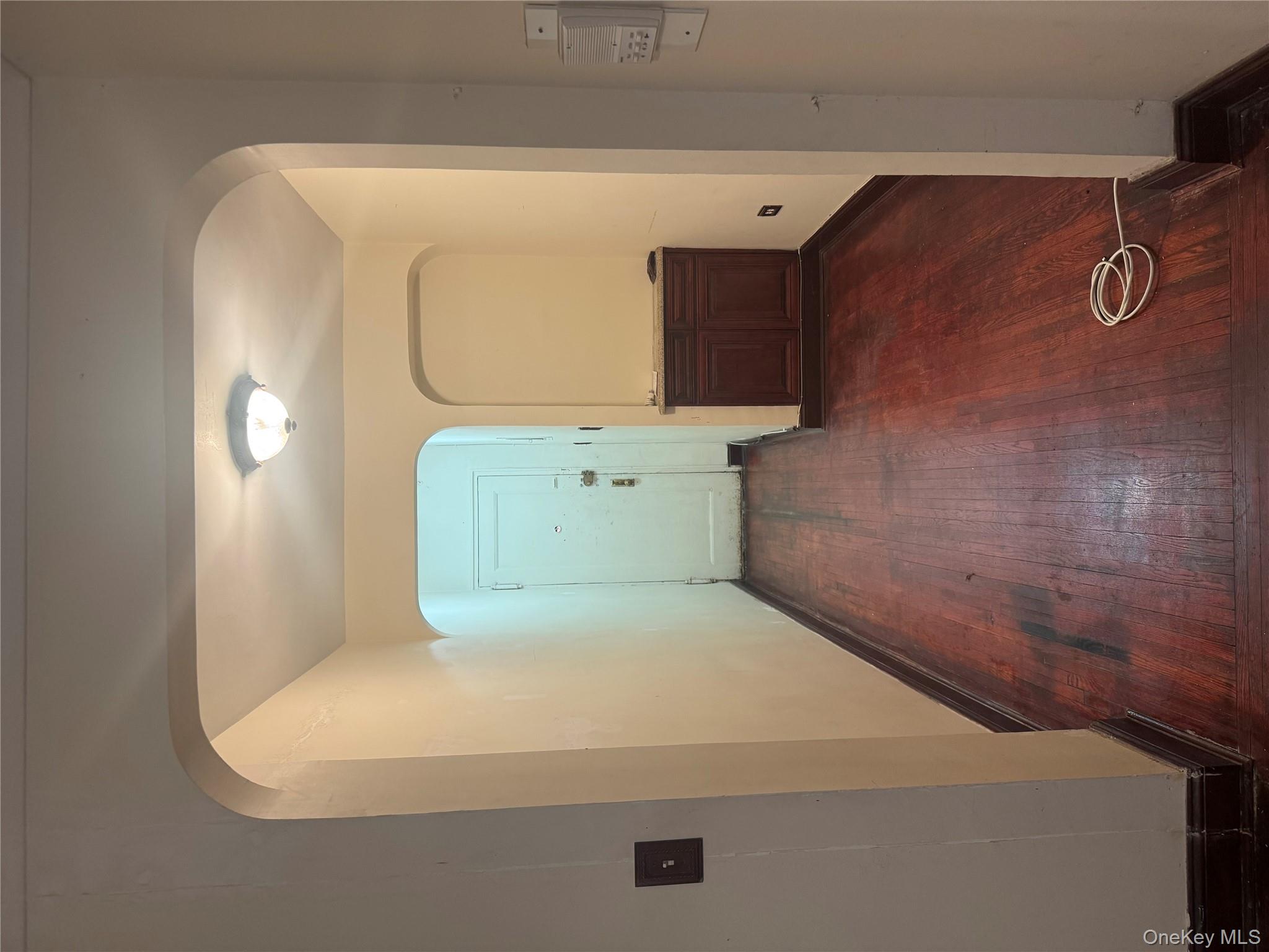 80-09 35th Avenue, Unit A12 Queens, NY 11372 - Photo 21 of 22 a view of a livingroom with wooden floor