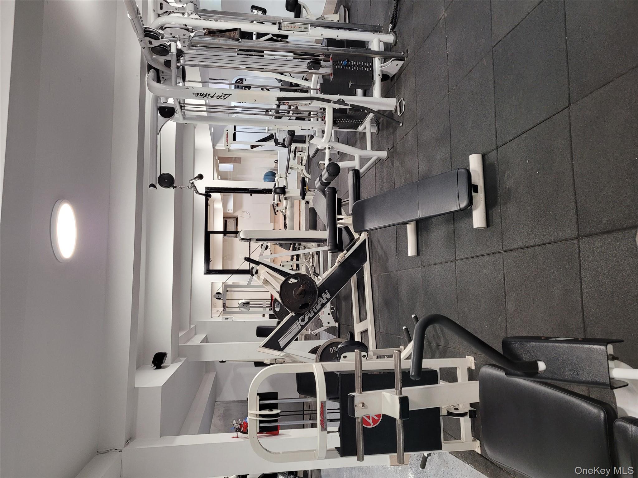 80-09 35th Avenue, Unit A12 Queens, NY 11372 - Photo 4 of 22 a view of a room with gym equipment