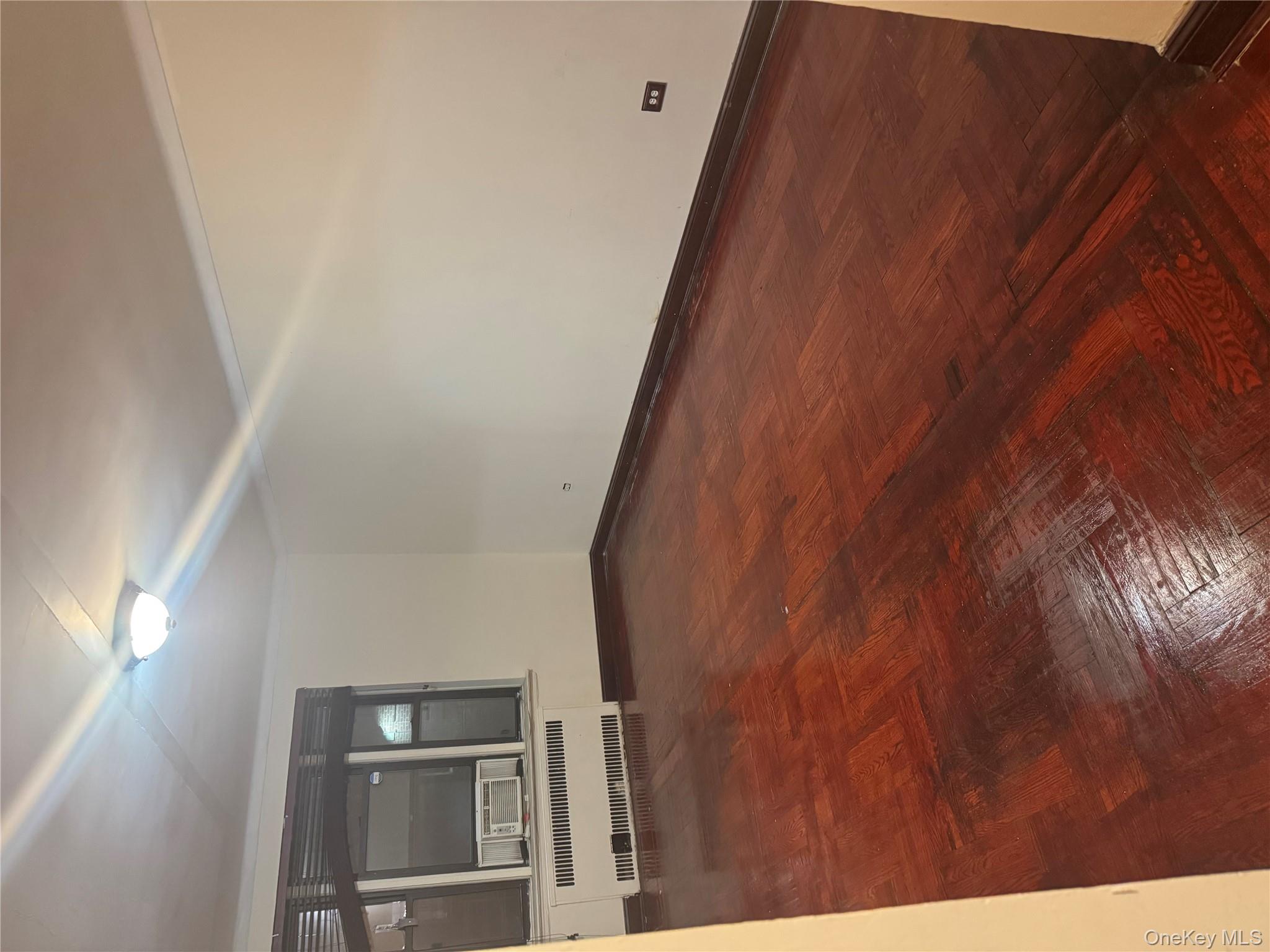 80-09 35th Avenue, Unit A12 Queens, NY 11372 - Photo 8 of 22 en empty room with window