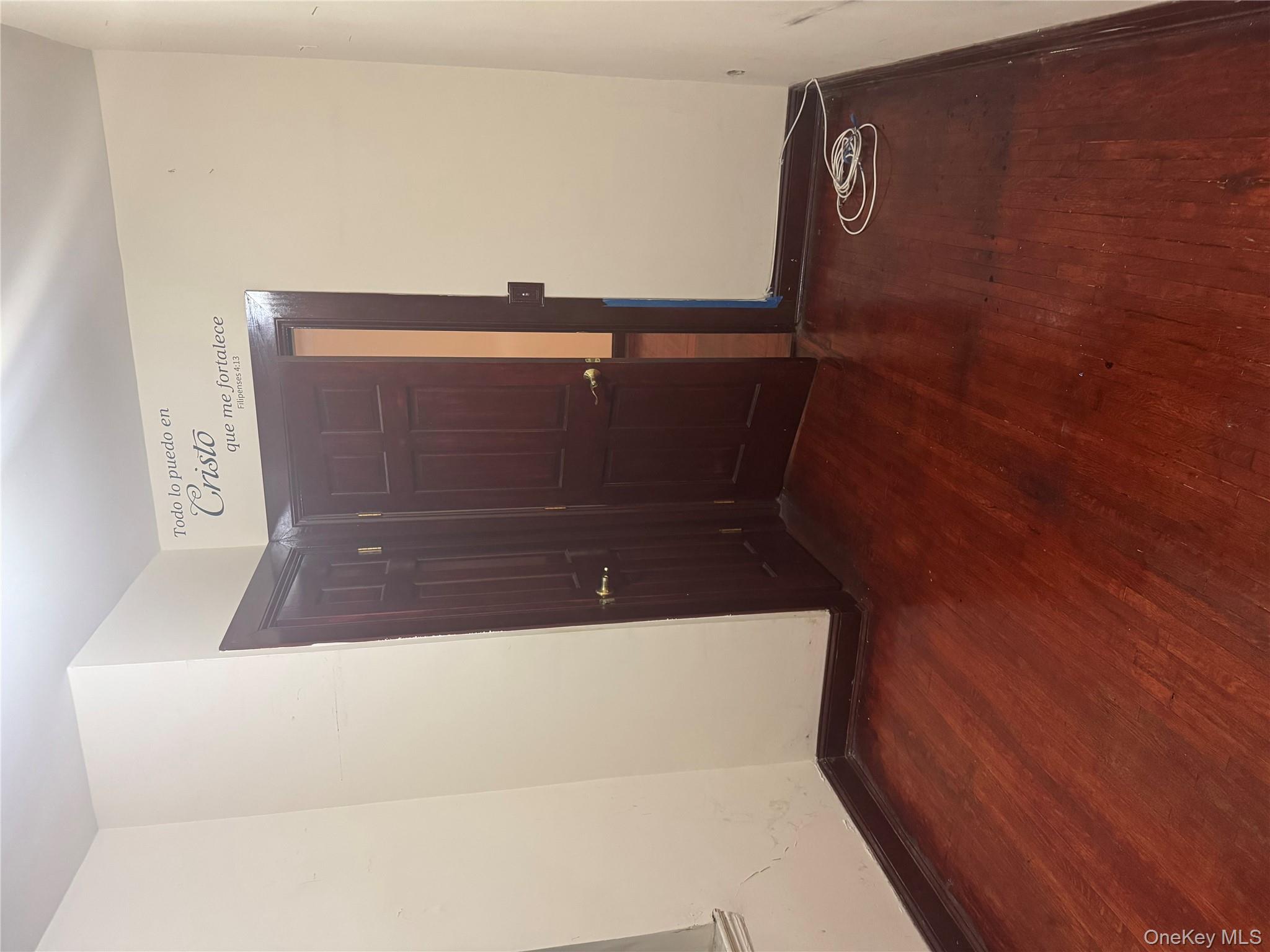 80-09 35th Avenue, Unit A12 Queens, NY 11372 - Photo 10 of 22 an empty room with wooden floor