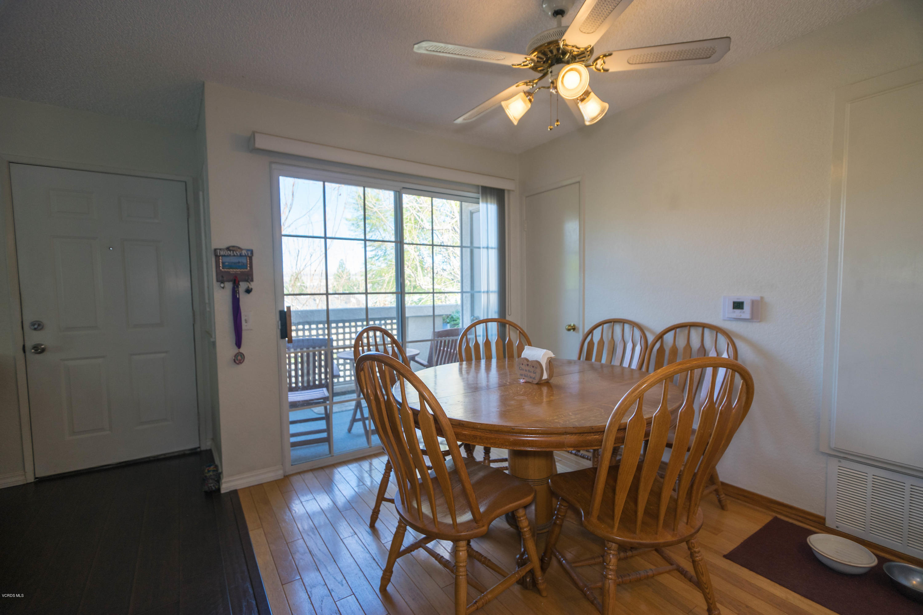 1055 Waltham Road, Unit D Simi Valley, CA 93065 - Photo 3 of 13 a view of a dining room with furniture window and wooden floor