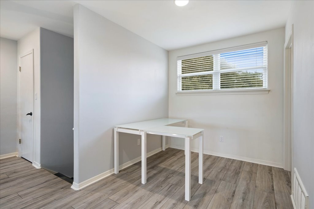 18231 Lakepoint Cove Lago Vista, TX 78645 - Photo 17 of 39 a view of a workspace with wooden floor