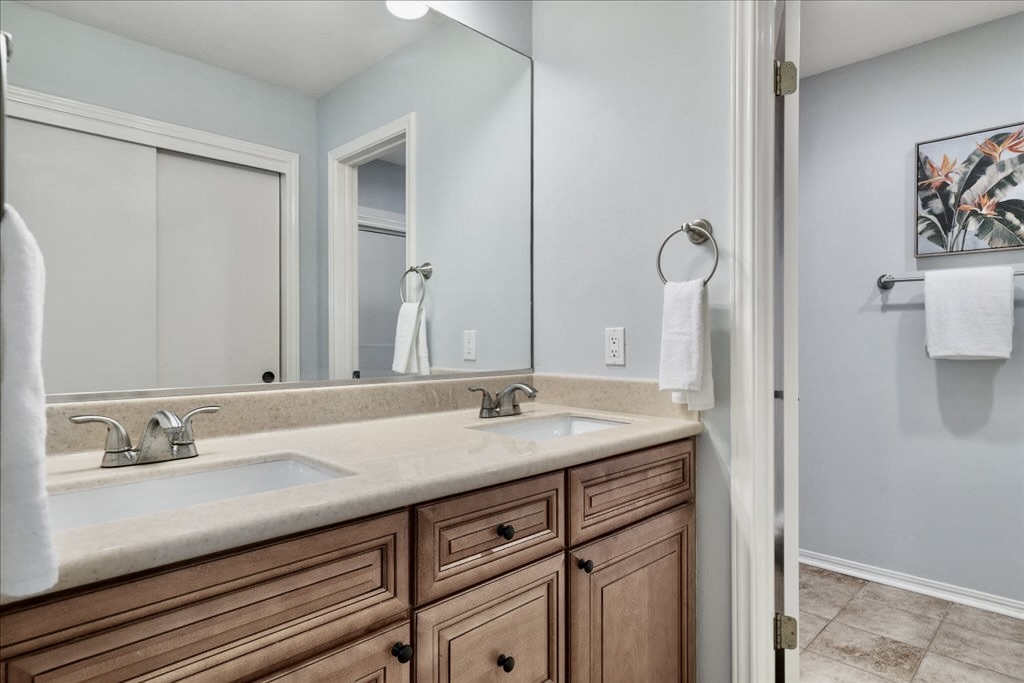 18231 Lakepoint Cove Lago Vista, TX 78645 - Photo 21 of 39 a bathroom with a granite countertop sink and a mirror
