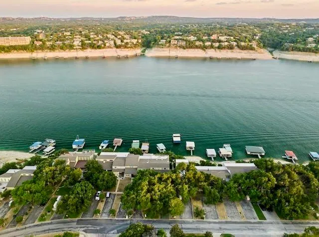 an aerial view of a house with a lake view