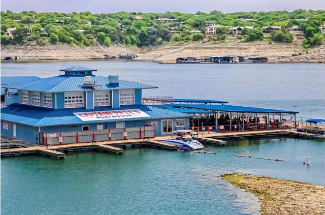 a view of swimming pool with trees in the background