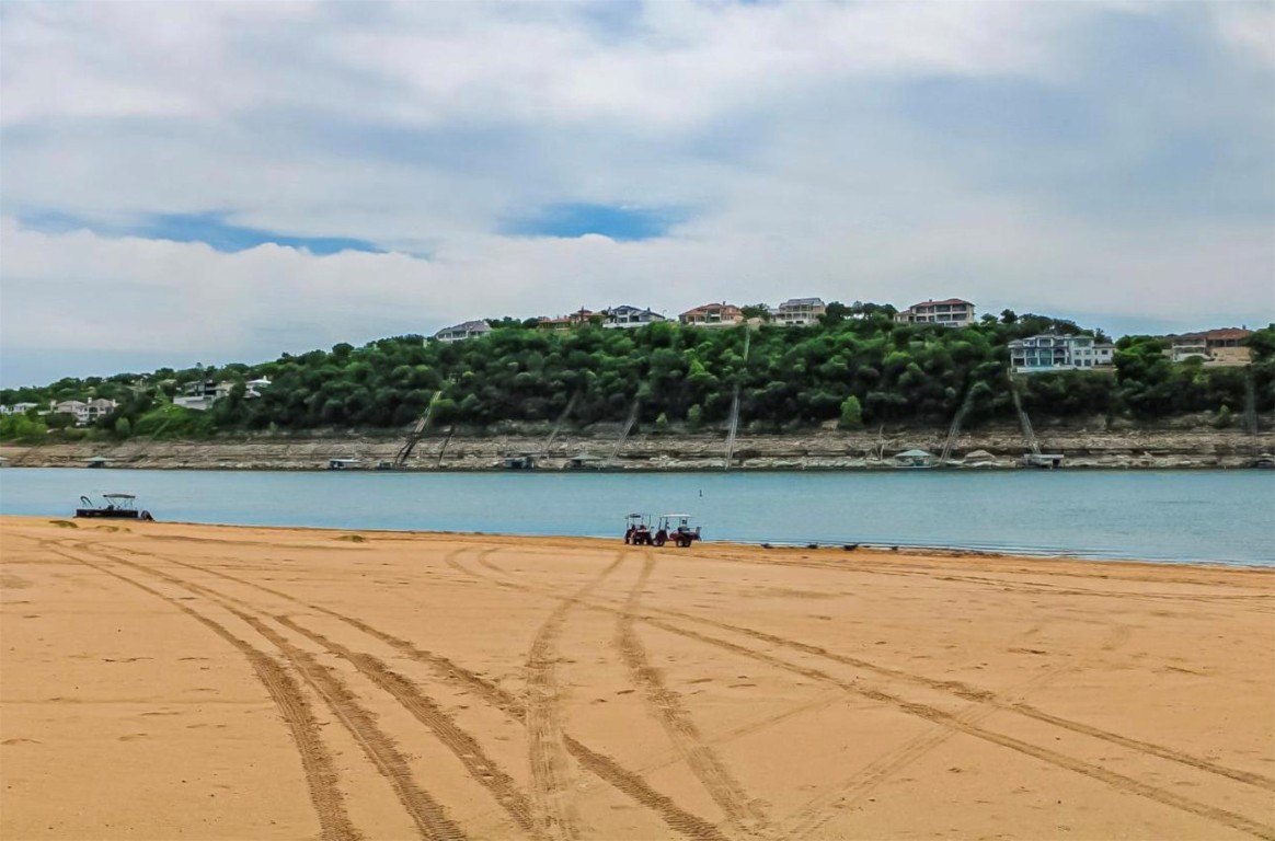 18231 Lakepoint Cove Lago Vista, TX 78645 - Photo 38 of 39 a view of swimming pool with trees in the background
