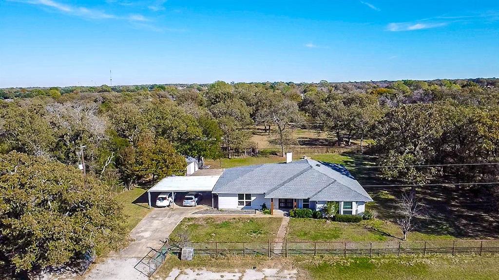 7185 Stephenson Levy Road Burleson, TX 76028 - Photo 1 of 1 The home. Notice the concrete drive extends past the carport for extra parking.