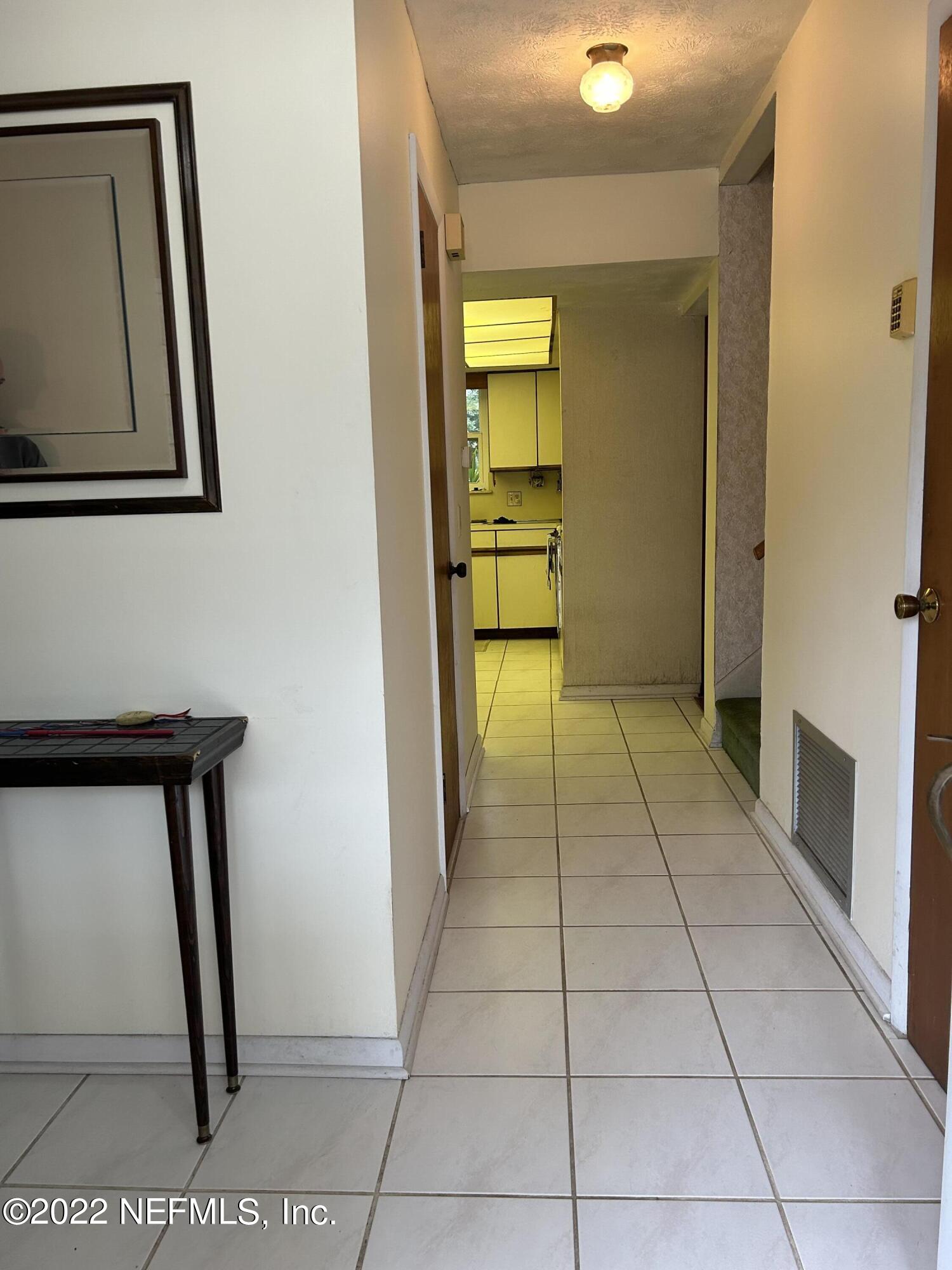 7116 St Augustine Road Jacksonville, FL 32217 - Photo 5 of 26 a view of an entryway with a door