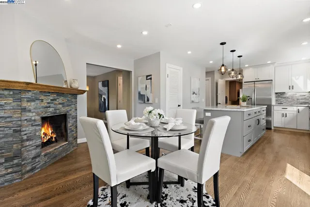 a large kitchen with a table and chairs