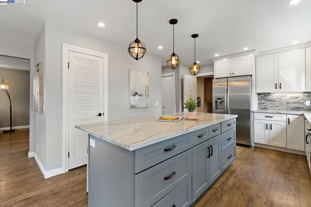 a bedroom with furniture window and wooden floor