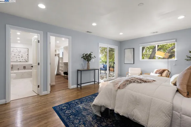 a bathroom with a double vanity sink toilet and shower