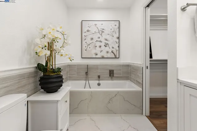 a view of room with window and ceiling fan