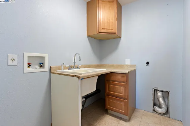 front view of a house with a tree