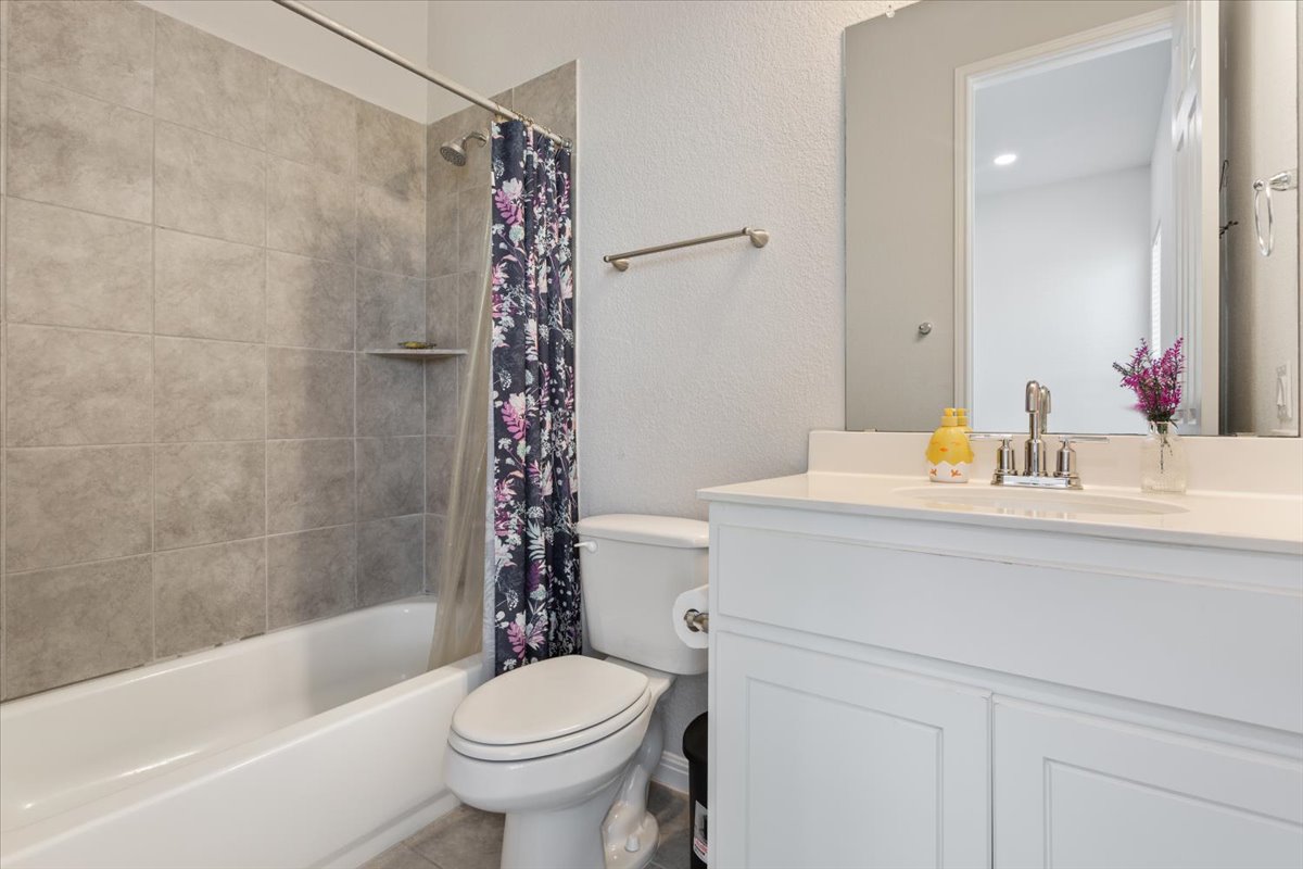 3625 Garrano Bend Leander, TX 78641 - Photo 24 of 38 A pristine bath features a spacious tub and shower with tile surround.