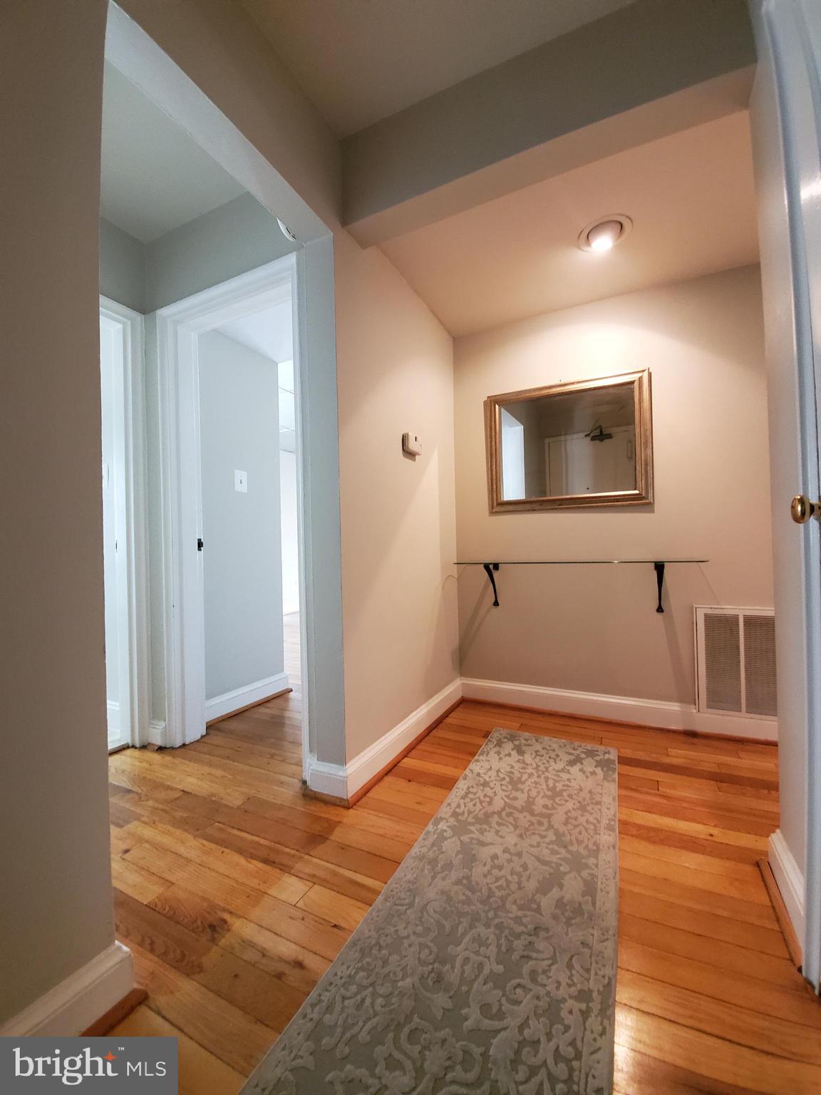 2902 13th Road South, Unit 301 Arlington, VA 22204 - Photo 2 of 20 Entrance Hallway with Floating Glass Console