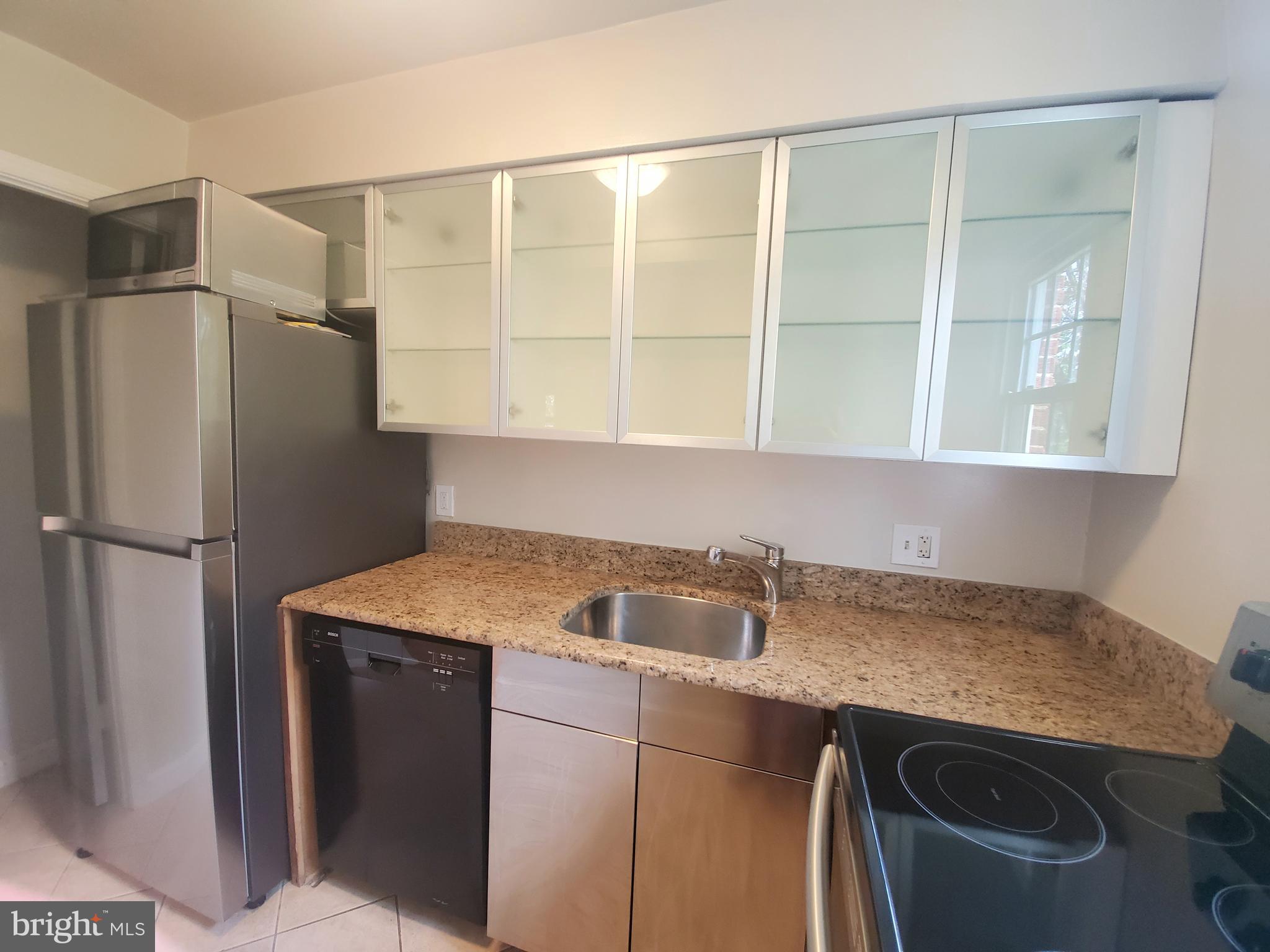 2902 13th Road South, Unit 301 Arlington, VA 22204 - Photo 6 of 20 Kitchen with Wall of Cabinets