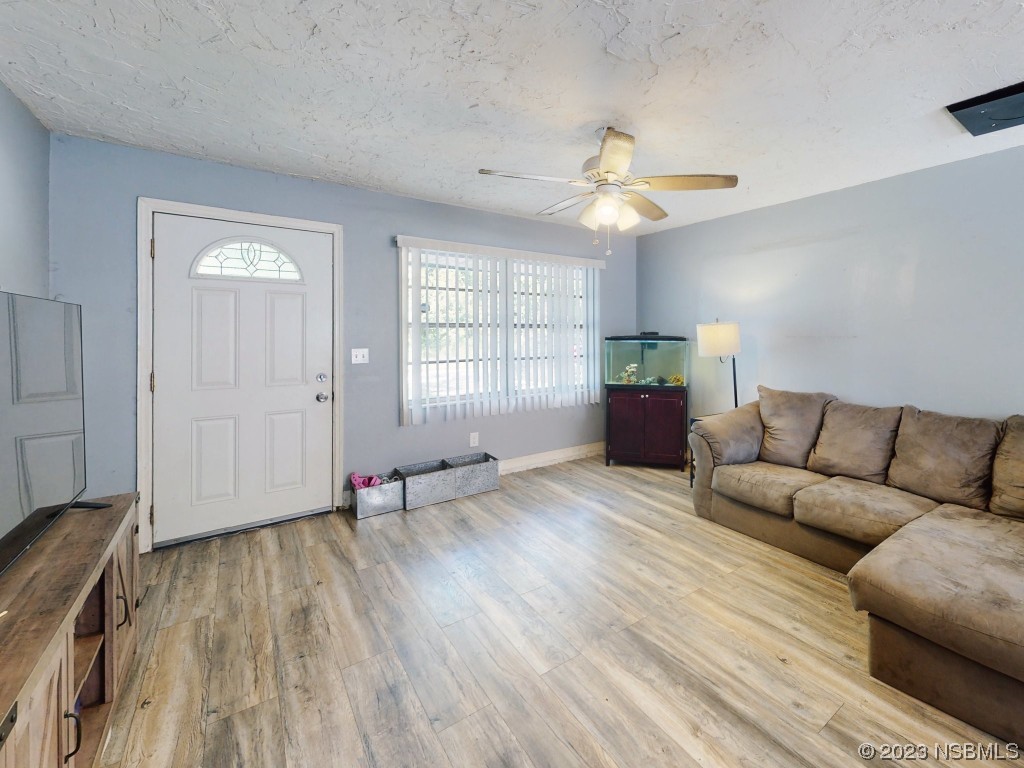 2761 Evergreen Drive Edgewater, FL 32141 - Photo 26 of 61 a living room with furniture and wooden floor