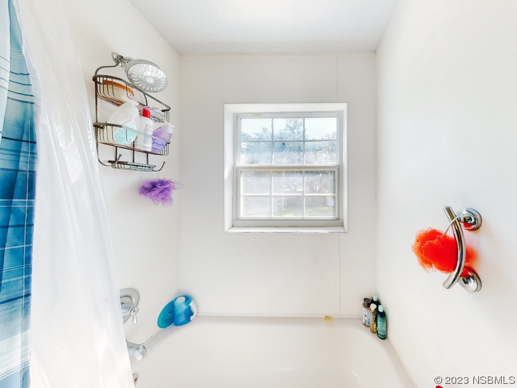 2761 Evergreen Drive Edgewater, FL 32141 - Photo 31 of 61 a white bath tub sitting next to a white wall