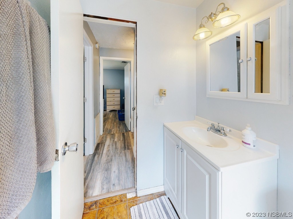 2761 Evergreen Drive Edgewater, FL 32141 - Photo 32 of 61 a bathroom with a sink and a mirror