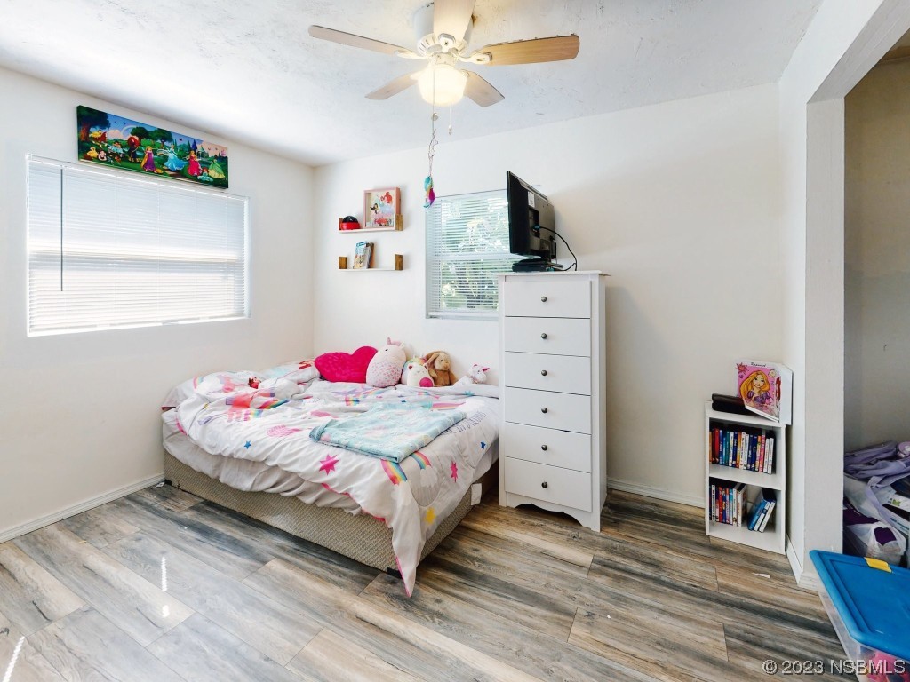 2761 Evergreen Drive Edgewater, FL 32141 - Photo 33 of 61 a bedroom with a bed and a dresser