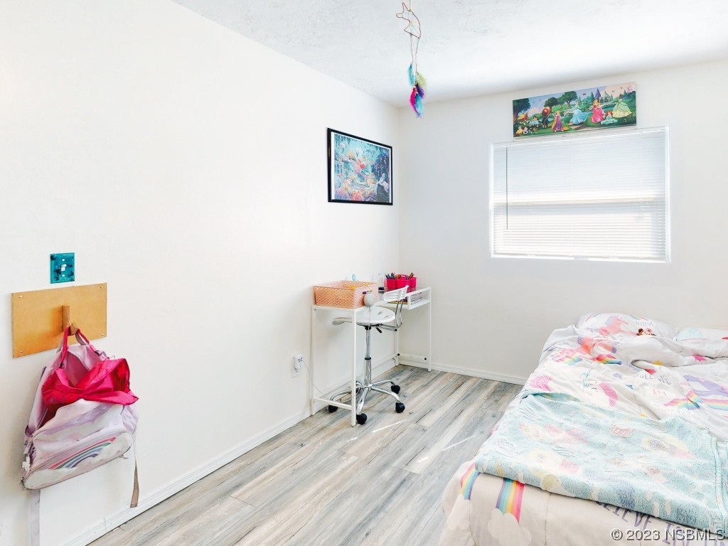 2761 Evergreen Drive Edgewater, FL 32141 - Photo 34 of 61 a workspace with furniture and wooden floor