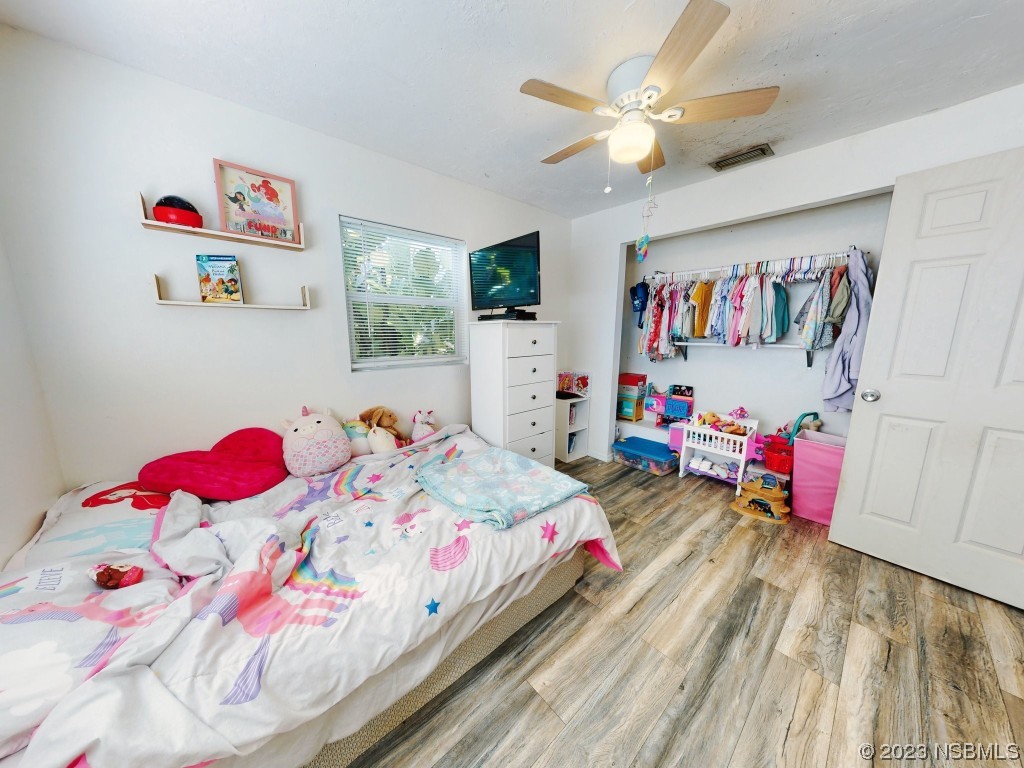 2761 Evergreen Drive Edgewater, FL 32141 - Photo 35 of 61 a bedroom with furniture and a bed