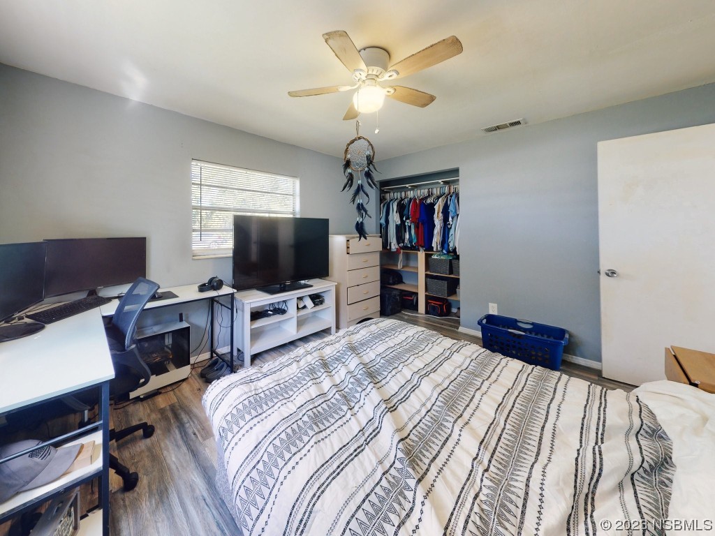 2761 Evergreen Drive Edgewater, FL 32141 - Photo 39 of 61 a bedroom with bed and a flat screen tv