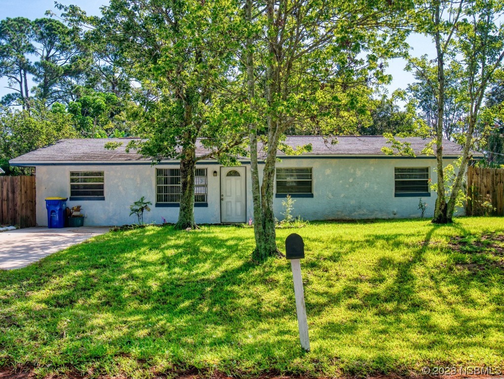 2761 Evergreen Drive Edgewater, FL 32141 - Photo 45 of 61 a front view of a house with garden