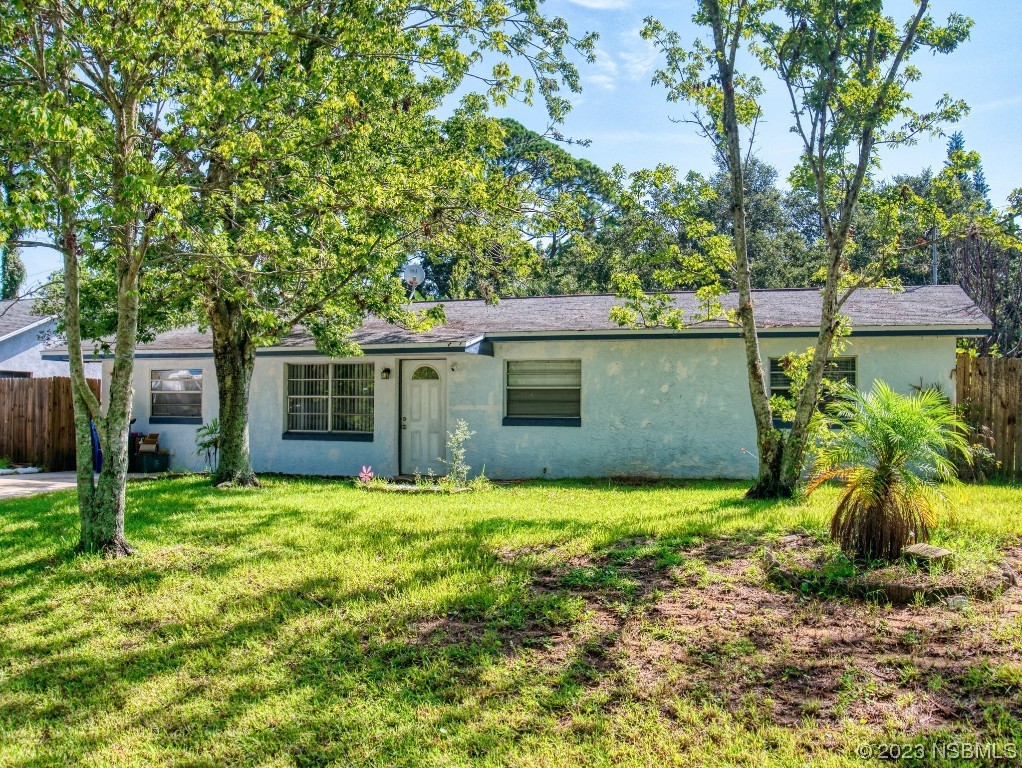 2761 Evergreen Drive Edgewater, FL 32141 - Photo 47 of 61 a view of a back yard of the house