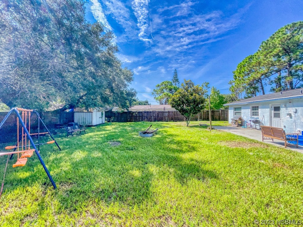 2761 Evergreen Drive Edgewater, FL 32141 - Photo 51 of 61 a view of house with backyard space and garden