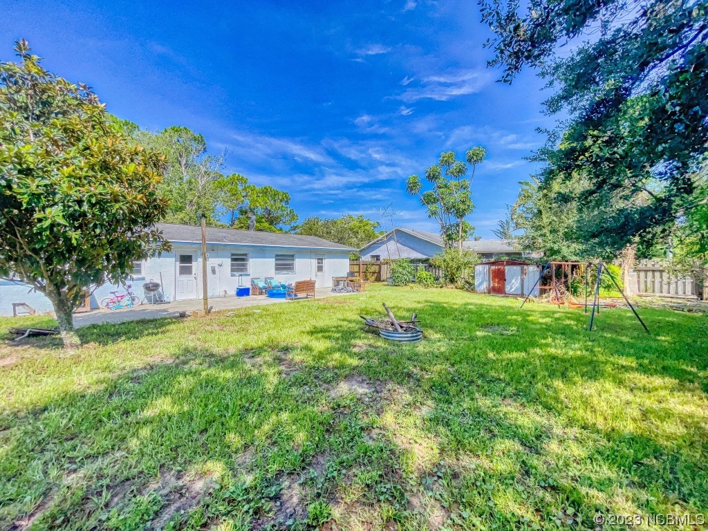 2761 Evergreen Drive Edgewater, FL 32141 - Photo 54 of 61 a front view of a house with garden